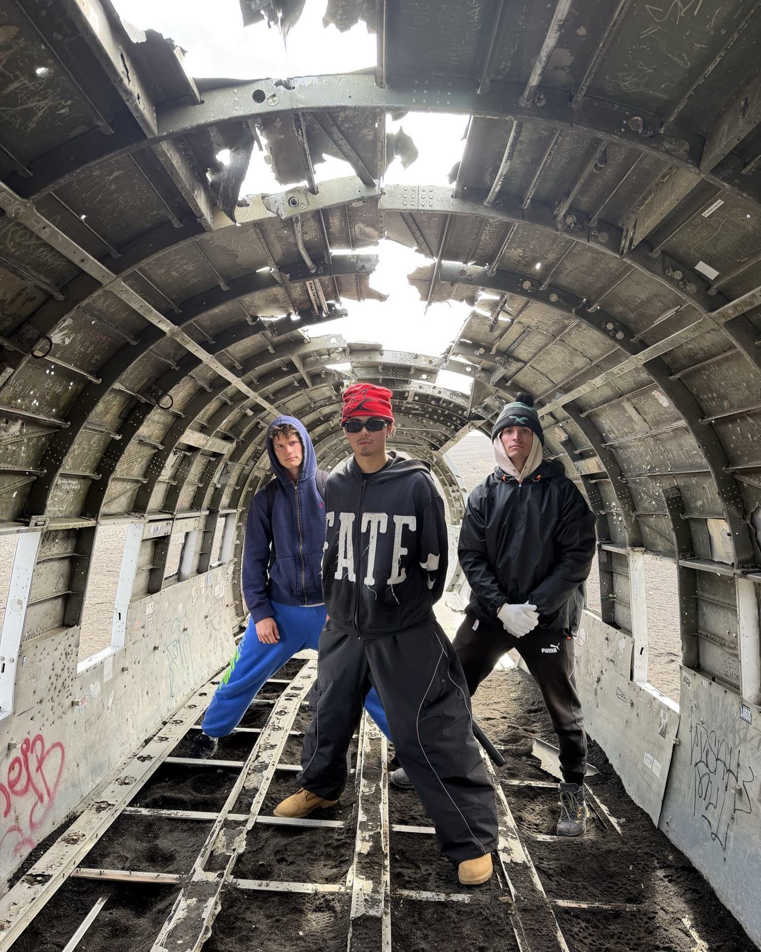 Standing inside the abandoned plane wreck on the black sand
