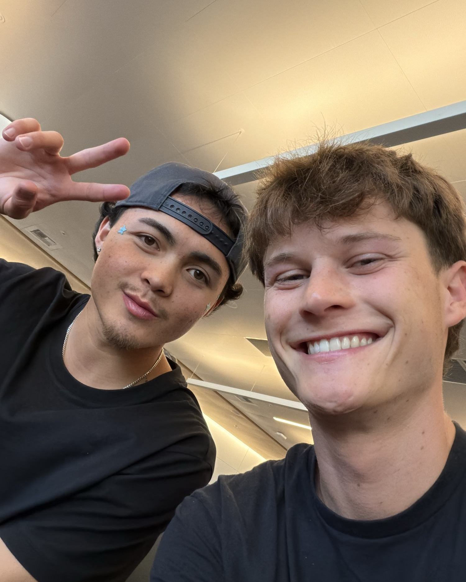 Two of the crew smiling on the standby flight to Iceland
