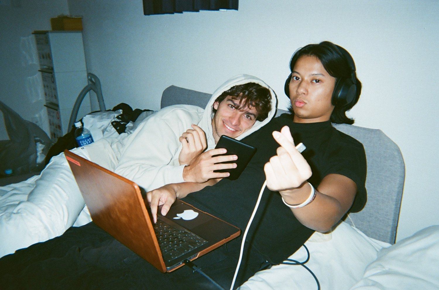 Owen and Auzi planning the video with a laptop and microphone